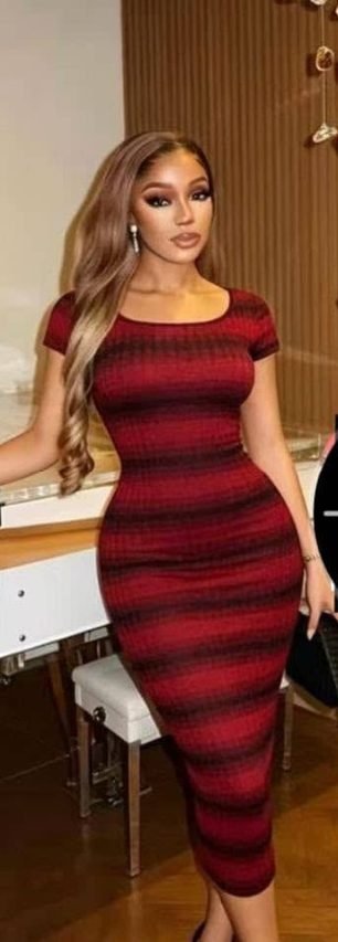 Woman wearing a red striped bodycon midi dress from Fazzy Fashion & Designs